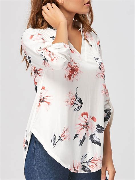 white blouse with floral print.